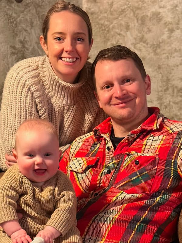 Brian with his wife and their son at 4 months old
