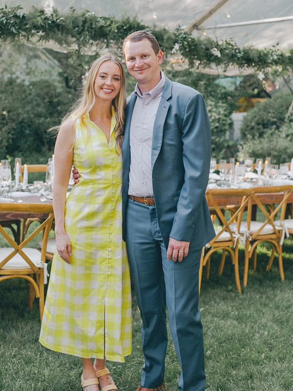 Brian with his wife at a wedding
